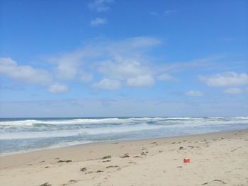 Scenic view of beach against sky
