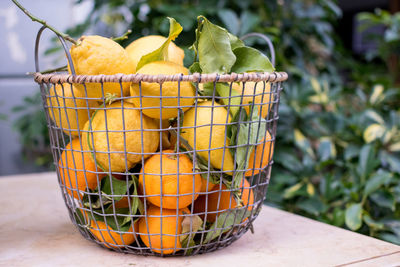 Close-up of orange fruit in basket