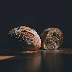 Close-up of bread against black background