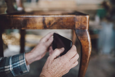 Close-up of man using mobile phone