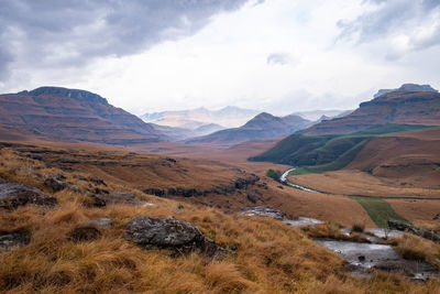 Scenic view of landscape and mountains against sky