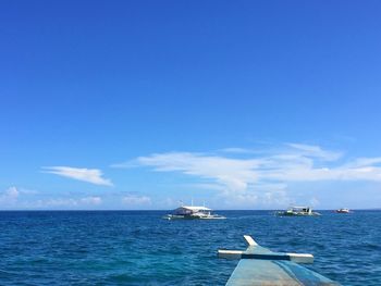 Scenic view of sea against blue sky