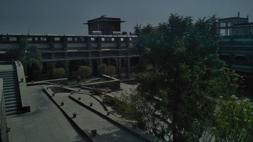 High angle view of street and buildings against sky