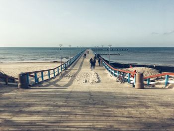 Pier over sea against sky