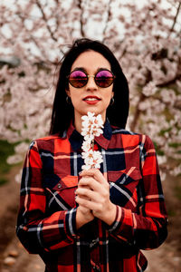 Portrait of beautiful young woman wearing sunglasses