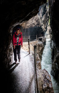 Portrait of man standing in cave