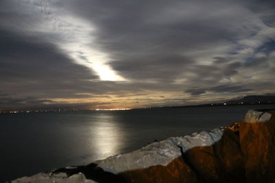 Scenic view of sea against sky at sunset