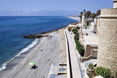 High angle view of beach by sea against sky