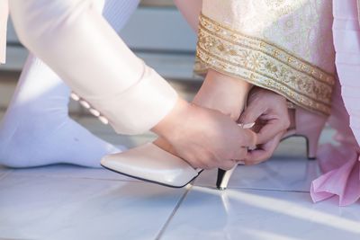 Low section of woman standing on floor