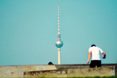 Rear view of man by fernsehturm