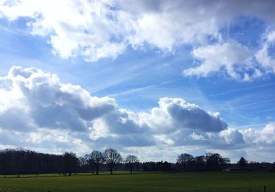 Scenic view of landscape against cloudy sky