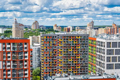 Buildings in city against sky