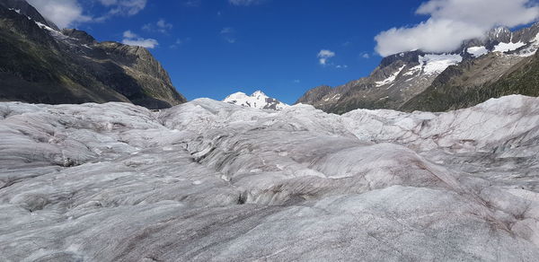 Aletsch glacier in the swiss alps with snowcapped mountains against sky