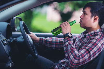 Man sitting in car