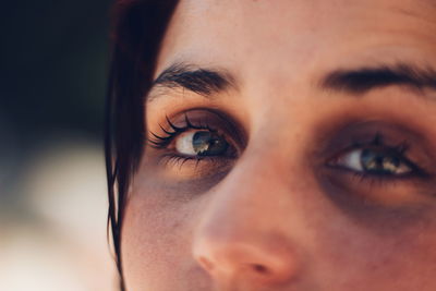 Close-up portrait of woman with gray eyes