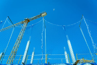 Low angle view of wire against clear blue sky