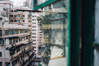 Buildings in city see through window