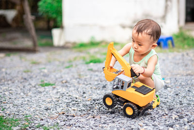 Boy playing with toy car