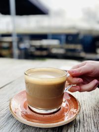 Close-up of coffee cup on table