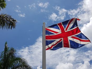 Low angle view of flag against sky