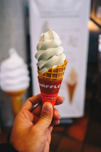 Hand holding ice cream cone