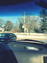 Reflection of car on side-view mirror