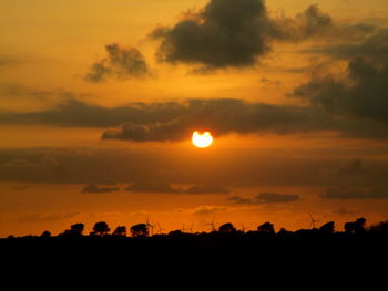 Scenic view of silhouette landscape against sky during sunset