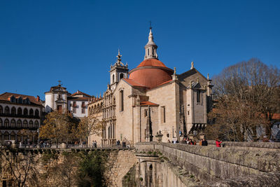 Low angle view of historic building against clear blue sky