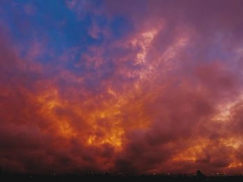 Low angle view of dramatic sky during sunset