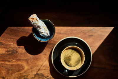 High angle view of coffee cup on table