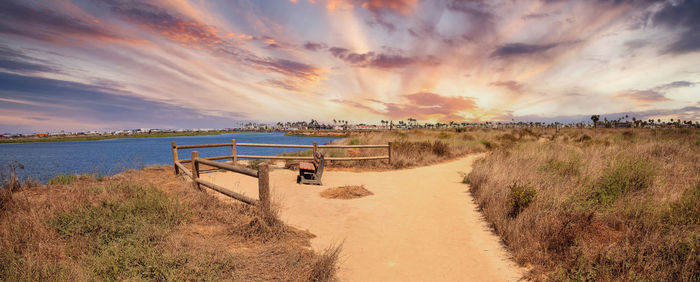 Bench overlooking the marsh of bolsa chica wetlands in huntington beach, california, usa