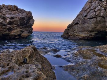 Scenic view of sea against sky during sunset