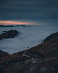 Scenic view of rocky mountains against sky during sunset