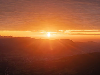 Scenic view of dramatic sky during sunset