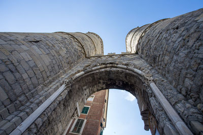 Low angle view of old ruins against clear sky