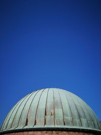 Low angle view of building against blue sky