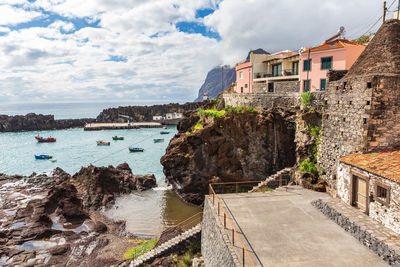 Panoramic view of beach against buildings in town