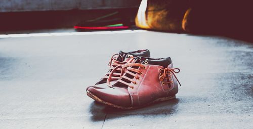 Close-up of red shoes on floor