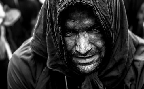 Close-up portrait of man wearing mask