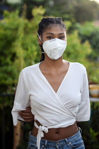 Young black woman in face mask