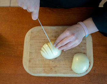 High angle view of person preparing food on table