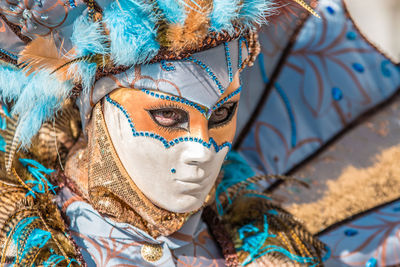 Close-up of a young woman with face paint