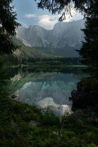 Scenic view of lake and mountains against sky