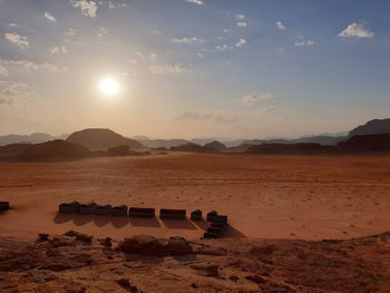 Scenic view of desert against sky during sunset