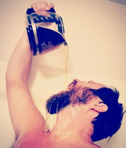 Close-up of young woman in drinking water