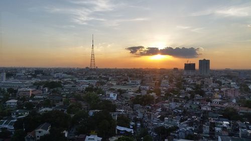 Cityscape against sky during sunset