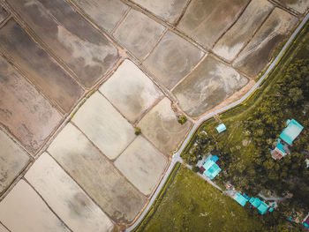 High angle view of footpath by buildings in city