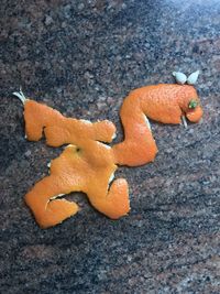 High angle view of orange on leaf