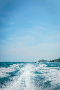 Scenic view of sea against blue sky