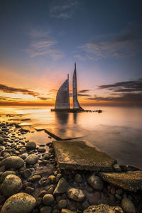 Scenic view of sea against sky during sunset